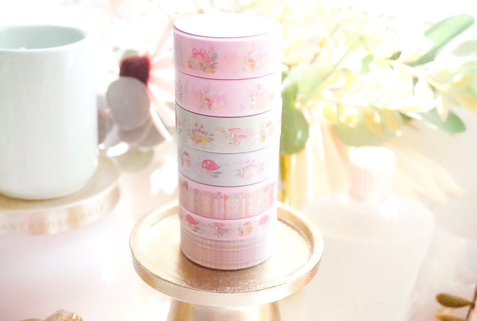 Stack of Simply Gilded foil washi tape rolls displaying crisp edge finishing and foil alignment