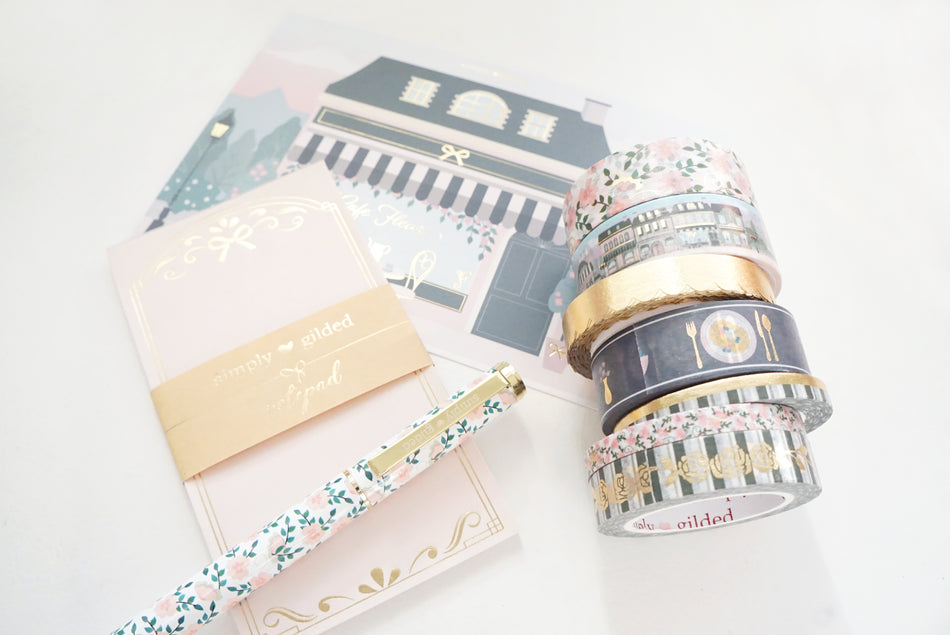 Styled desk layout with functional planner stickers and stationery tools